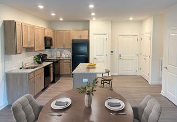 Newark apartment for rent - A modern kitchen with a dining table set for two.
