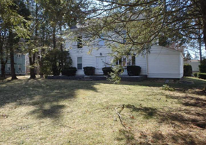 Smithfield apartment for rent - A white house with a tree in front.