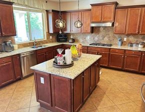 Chandler house for rent - A kitchen with brown cabinets and a granite countertop.