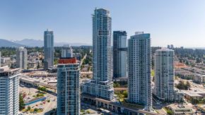Coquitlam apartment for rent - A cityscape with tall buildings and a clear sky.