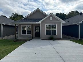 Little Rock house for rent - A house with a grey roof and a grey garage door.