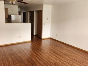 Salem apartment for rent - A room with wooden floors and white walls.
