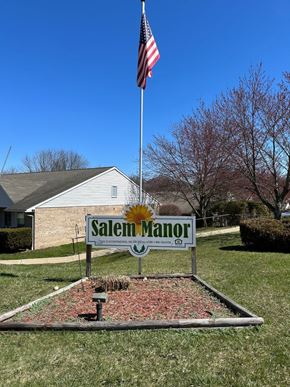 Salem apartment for rent - A sign that says Salem Manor in front of a house.