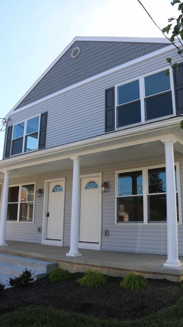 Laureldale house for rent - A house with a grey roof and white columns.