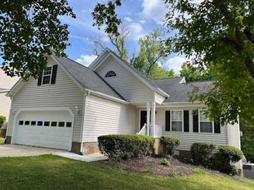 Chapel Hill house for rent - A house with a white garage door and a brick pillar.