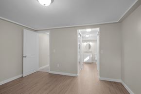 Belmont house for rent - A white door is open to a laundry room.