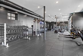 Columbus apartment for rent - A gym with a variety of equipment including weights and cardio machines.