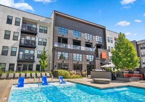 Columbus apartment for rent - A kitchen with a table and chairs in front of a refrigerator and oven.
