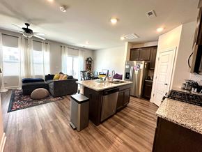 Greenville house for rent - A modern kitchen with a large island and stainless steel appliances.
