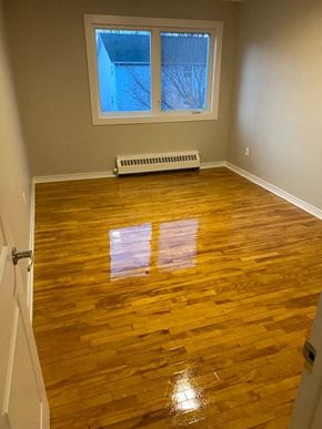 Halifax apartment for rent - A room with wooden floors and a window.