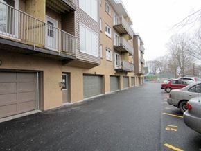 Halifax apartment for rent - A parking lot in front of apartment buildings.