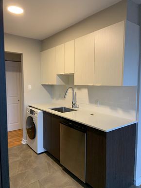 Halifax apartment for rent - A modern kitchen with a washer and dryer built in.