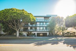 Santa Monica apartment for rent - A modern building with a tree in front of it.