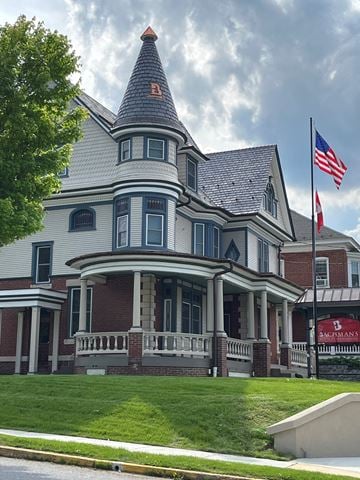 Wernersville apartment for rent - A large house with a flag on the front.