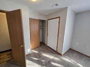 San Antonio apartment for rent - A room with a brown door and a white door.