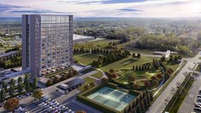Southgate apartment for rent - A modern building with a pool and a green area in front.