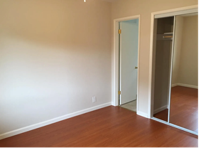 San Jose apartment for rent - A room with a white door and a mirror on the wall.