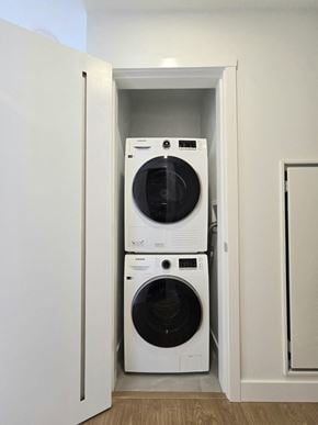 Surrey apartment for rent - A white washing machine and dryer in a small laundry room.