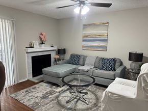 Irving house for rent - A living room with a grey couch, a coffee table, and a fireplace.