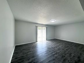 Columbia apartment for rent - A room with a slanted ceiling and a doorway leading to a balcony.