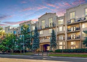 Calgary apartment for rent - A large building with a sign that says "Cinnamon" on it.