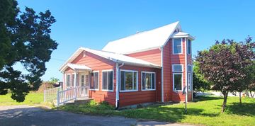 Chilhowee house for rent - A red house with a white roof and a porch.