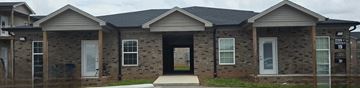 Bowling Green apartment for rent - A house with a grey roof and a black door.