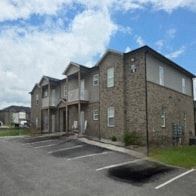 Bowling Green apartment for rent - Apartment building with a parking lot in front.