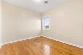 Union City apartment for rent - A room with wooden floors and a window.