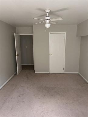 Bedford apartment for rent - A room with a ceiling fan and two doors.