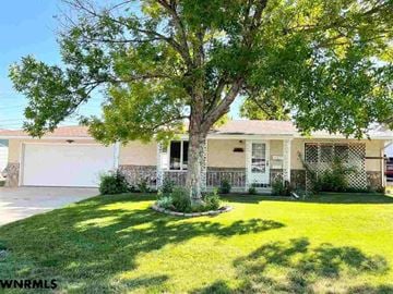 Gering house for rent - A house with a tree in front of it.