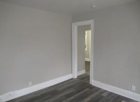 Bedford apartment for rent - A room with a doorway leading to another room.
