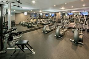 New York apartment for rent - A spacious gym with a variety of equipment including treadmills, stationary bikes, and weight machines.