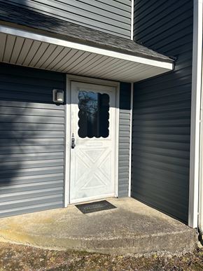 Laurys Station apartment for rent - A white door with a diamond pattern on the side is closed.