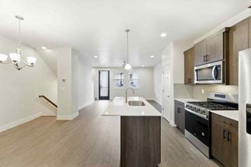 Bend apartment for rent - A modern kitchen with a stainless steel oven and microwave.