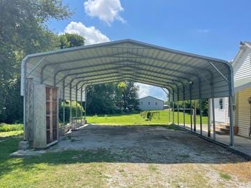 New Albany house for rent - A covered walkway leads to a building.