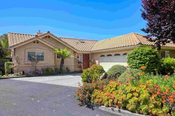 Grover Beach house for rent - A house with a red tile roof and a driveway in front.