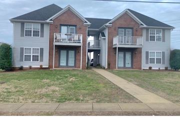 Bowling Green apartment for rent - A two-story brick house with a balcony on the second floor.