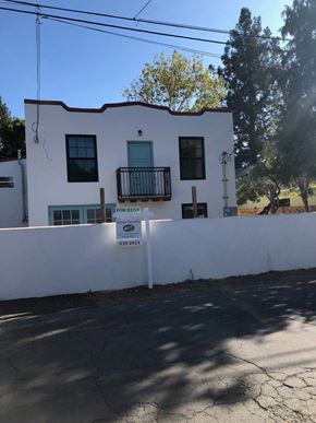 Sonoma apartment for rent - A white house with a sign in front of it.