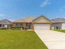 Foley house for rent - A house with a brown roof and a driveway in front.