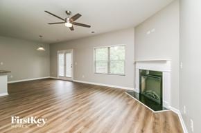 Winder house for rent - A spacious room with a ceiling fan and wooden flooring.
