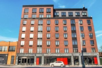 Brooklyn apartment for rent - A red brick building with a sign that says "EMS Special Services Day Habilitation.".
