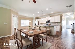 Canton house for rent - A dining room with a wooden table and chairs.