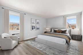 Bayonne apartment for rent - A bedroom with a large bed and a chair.