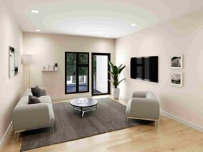 Elmsdale apartment for rent - A modern living room with a grey sofa, a coffee table, and a large window.