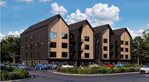 Elmsdale apartment for rent - A modern building with a parking lot in front.