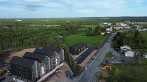 Elmsdale apartment for rent - A construction site with a building under construction and a road leading to it.