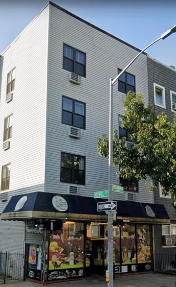 Brooklyn apartment for rent - A street view of a building with a storefront at the corner.