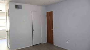Crystal River house for rent - A room with a white door and a brown door.