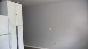 Crystal River house for rent - A white refrigerator is in the corner of a room with a white wall.